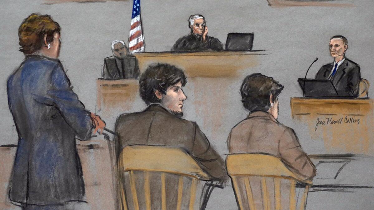 In this courtroom sketch, Bill Richard, right, testifies at the federal death penalty trial of Dzhokhar Tsarnaev, second from left, in Boston. Tsarnaev is between defense attorneys Judy Clarke, left, and Miriam Conrad and U.S. District Judge George O'Toole Jr. presides.