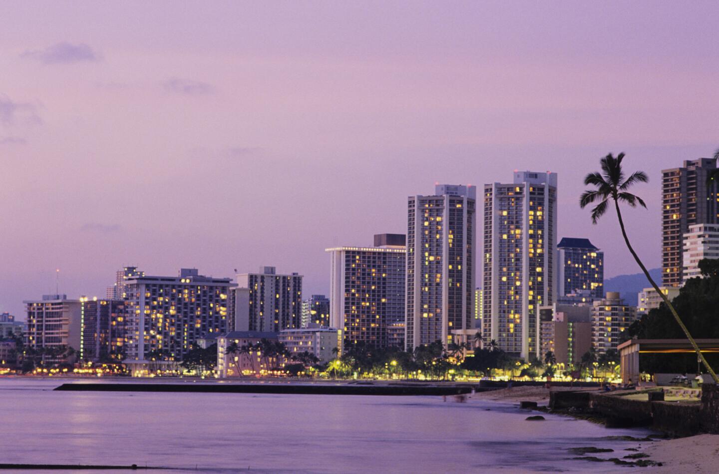 Honolulu, Waikiki hotels at dusk.