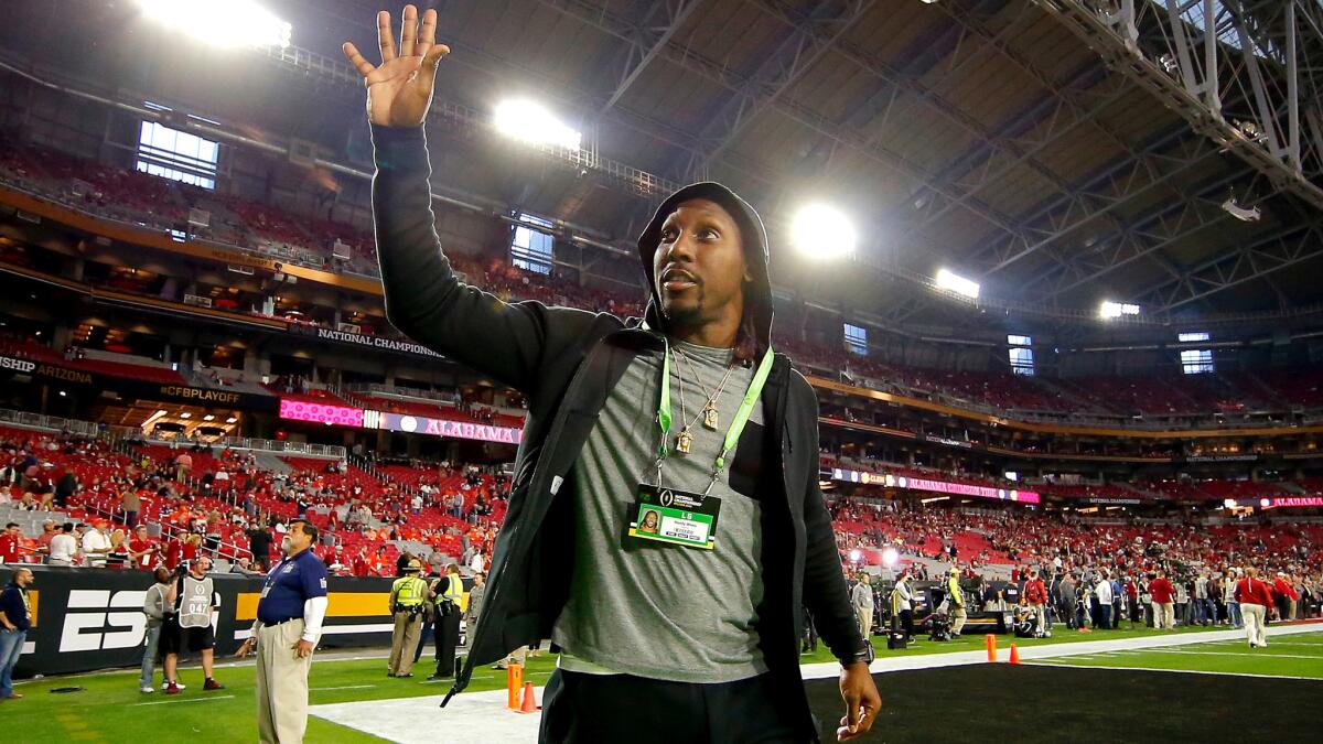 Roddy White waves to fans before the College Football Playoff championship game at University of Phoenix Stadium on Jan. 11.