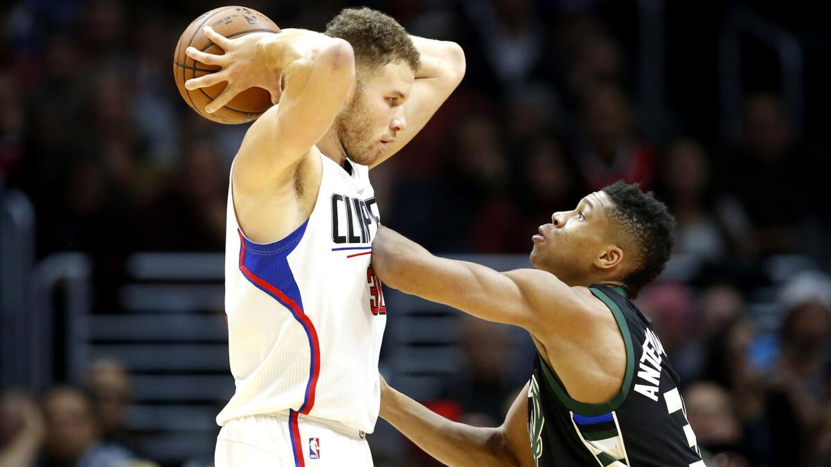 Clippers forward Blake Griffin, quarded tightly by Bucks forward Giannis Antetokounmpo on Wednesday, believes referees treat his team differently during conflicts on the court.