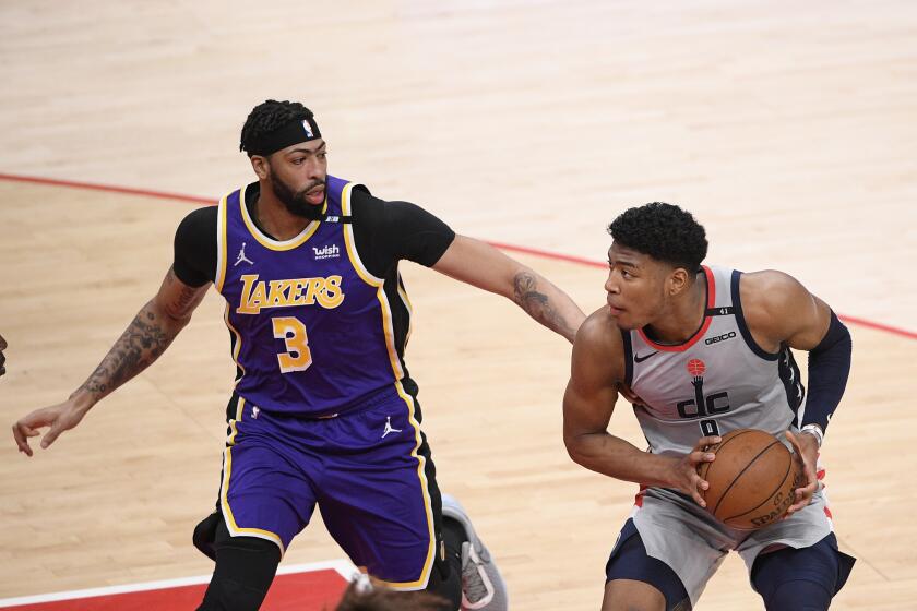 Washington Wizards forward Rui Hachimura (8) in action against Los Angeles Lakers forward Anthony Davis (3) during the first half of an NBA basketball game, Wednesday, April 28, 2021, in Washington. (AP Photo/Nick Wass)