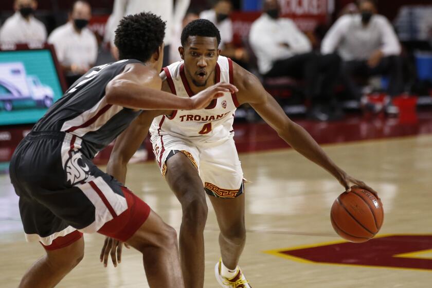 Southern California forward Evan Mobley (4) drives during an NCAA college basketball game.