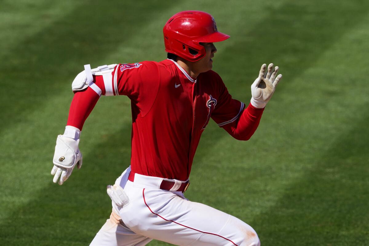 Angels designated hitter Shohei Ohtani runs during a spring training game.