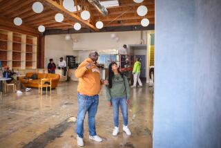 Los Angeles, CA - June 15: Hot & Cool Cafe owners Tony Jolly and wife Tina Amin inspects some of the recent renovations at their coffee shop on Thursday, June 15, 2023 in Los Angeles, CA. (Jason Armond / Los Angeles Times)