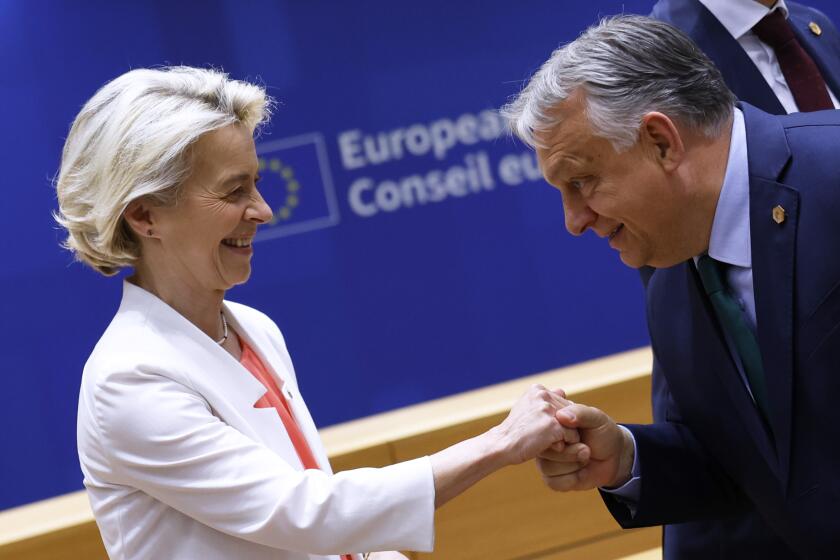 European Commission President Ursula von der Leyen, left, is greeted by Hungary's Prime Minister Viktor Orban during a round table meeting at an EU summit in Brussels, Monday, June 17, 2024. The 27 leaders of the European Union gather in Brussels on Monday evening to take stock of recent European election results and begin the fraught process of dividing up the bloc's top jobs, but they will be playing their usual political game with a deck of reshuffled cards. (AP Photo/Geert Vanden Wijngaert)