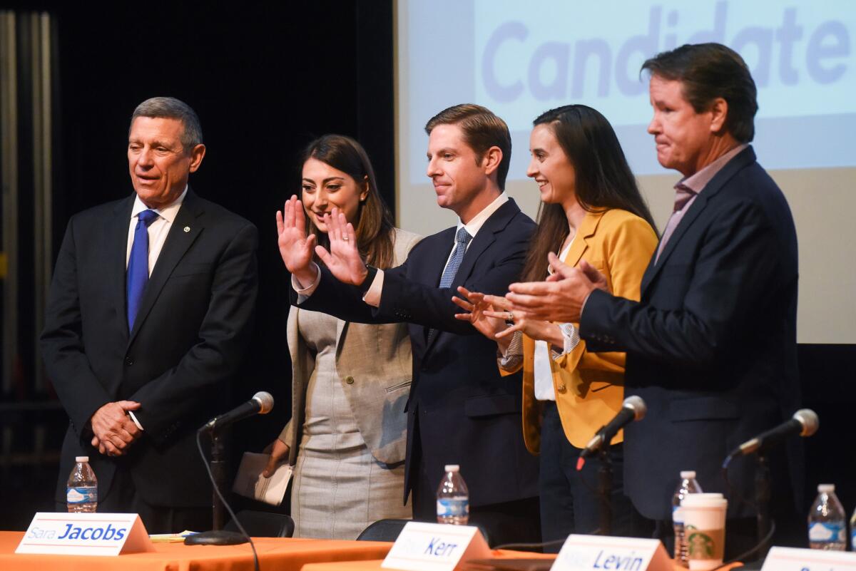 Candidates for the 49th congressional district acknowledge the audience after the debate.