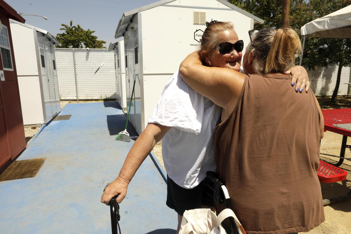 Beth Thompson receives a hug of support from Debby Moyer in North Hollywood.