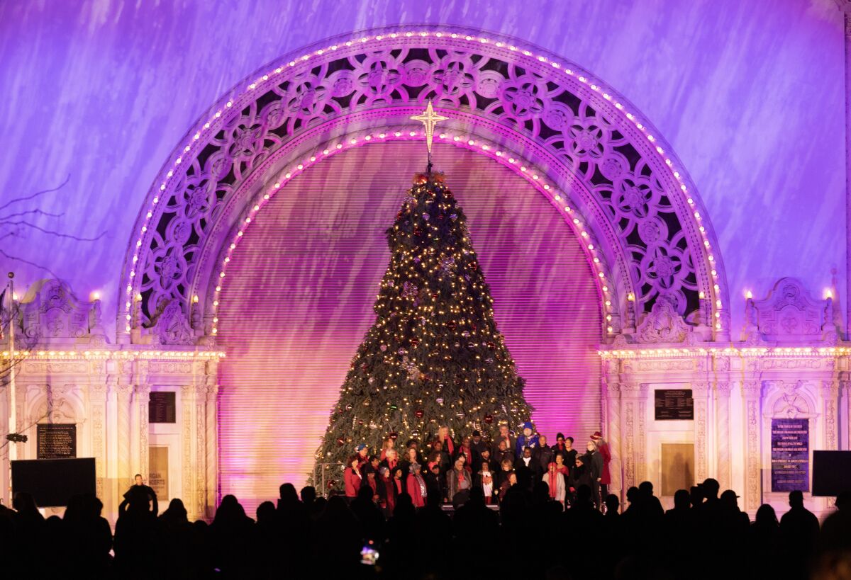 People fill Spreckels Organ Pavilion after a tree lighting ceremony during December Nights at Balboa Park.
