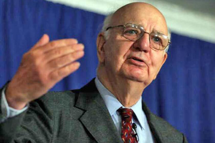 Monday, Aug. 8, 2005 — full caption: Former U.S. Federal Reserve Chairman Paul Volcker, who heads the Independent Inquiry Committee investigating alleged corruption in the United Nations oil–for–food program, gestures as he answers a question from the media during a press conference releasing the Committee’s third interim report Monday, Aug. 8, 2005 in New York. The report led by Volcker, was a new blow to the scandal–tainted $64 billion program. For the first time, it gave a motive for former program chief, Benon Sevan’s actions, saying his finances were “precarious” shortly before his alleged misdeeds. (AP Photo/Tina Fineberg)