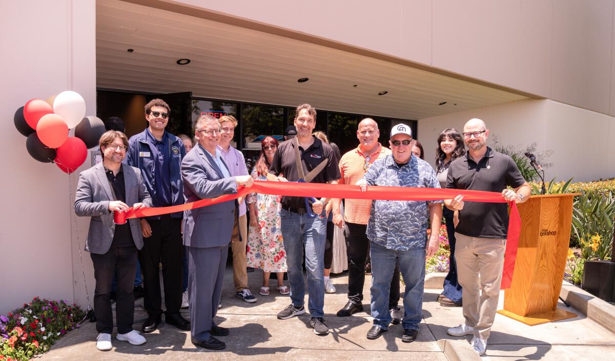 Local dignitaries gathered at Urban Workshop for the 10th anniversary celebration on July 13.