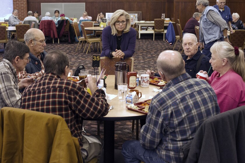 Rep. Liz Cheney speaks to a table full of senior citizens.