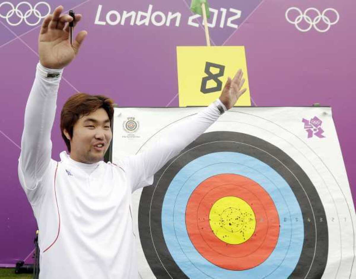 South Korea's Im Dong-hyun celebrates his world record.