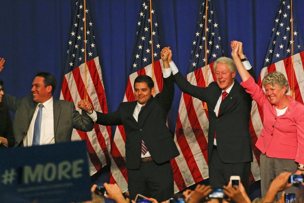 Former President Bill Clinton campaigned for Democratic congressional candidates at a rally on Oct. 29, 2014 at Oxnard College. From left are Redlands Mayor Pete Aguilar, Rep. Raul Ruiz of Palm Desert, Clinton and Rep. Julia Brownley of Westlake Village.