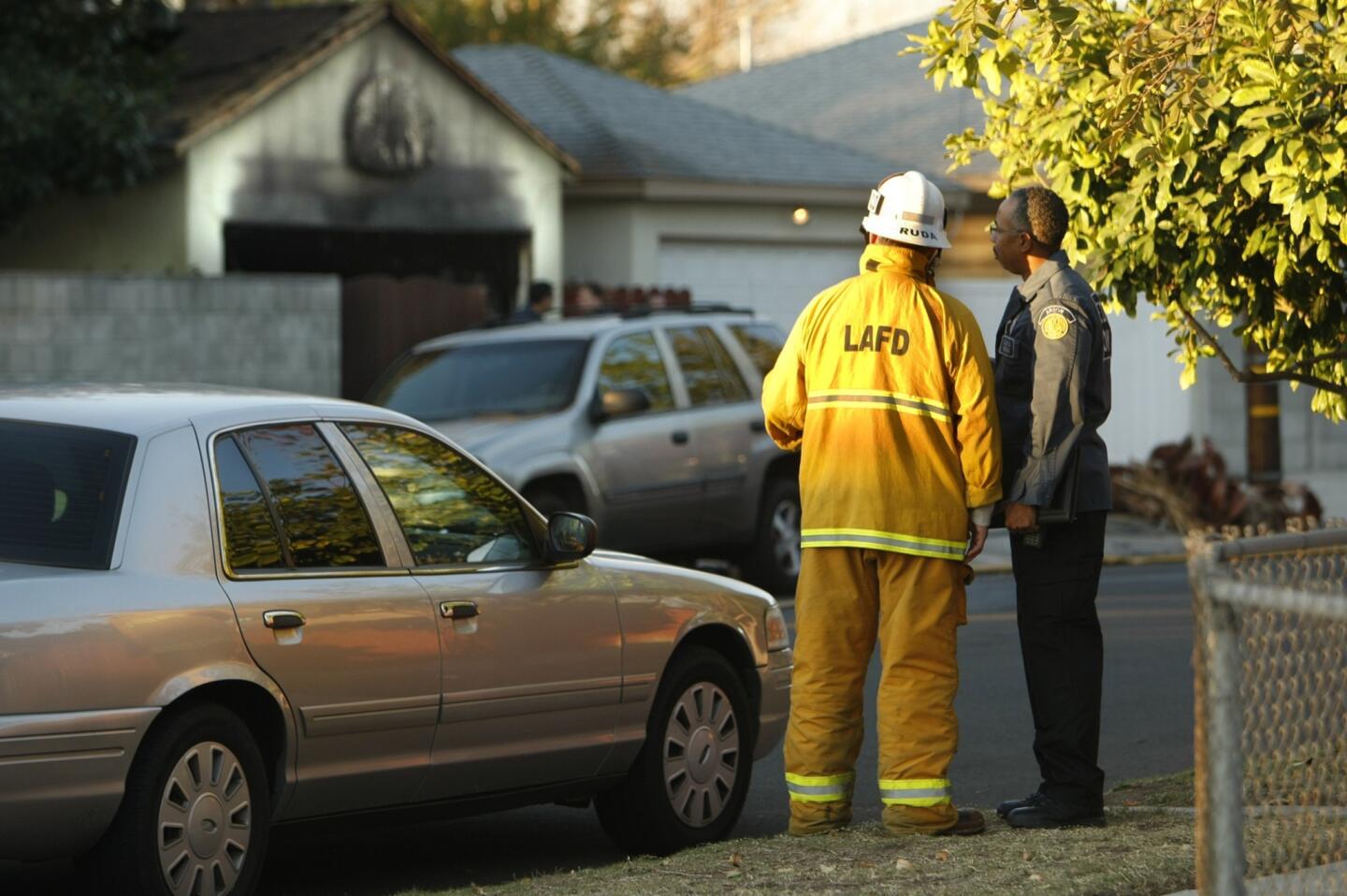 Firefighters responded about 4 a.m. to a report of a fire at a single-story home in the 7900 block of Sunnybrae Avenue, officials said. When they arrived at the home, they found a detached car garage engulfed in flames and heavy smoke.