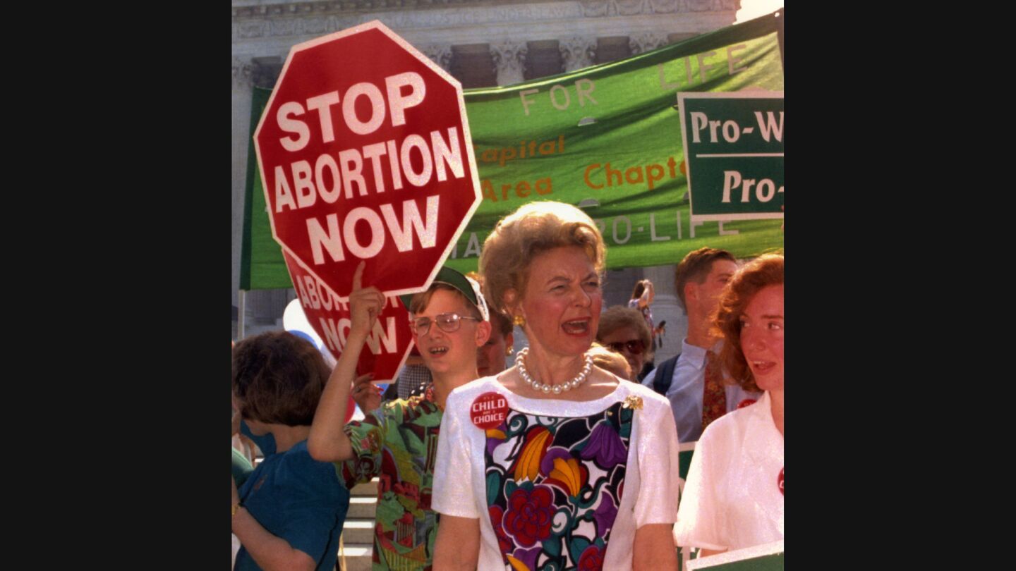 Phyllis Schlafly sings with demonstrators in front of the United States Supreme Court.