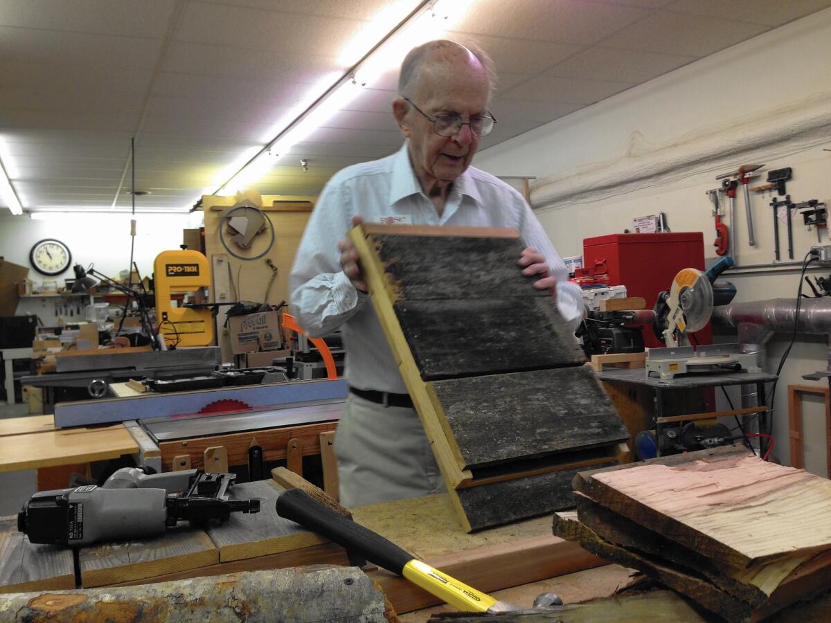 Bob Bennett, 88, builds bat houses to help attract the animals to Rose Villa. The community hopes to harvest its own bat guano to fertilize its gardens.