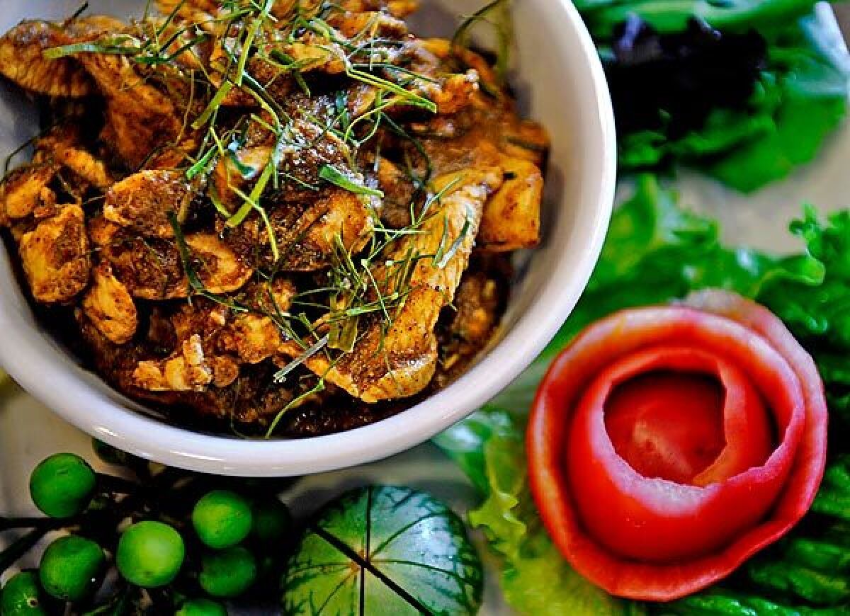 Kuah gling with chicken is a southern-style dry meat curry.
