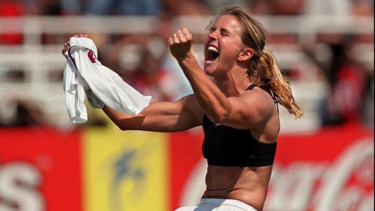 Brandi Chastain celebrates after scoring on a penalty kick to secure the 1999 World Cup title for the U.S. women's soccer team.