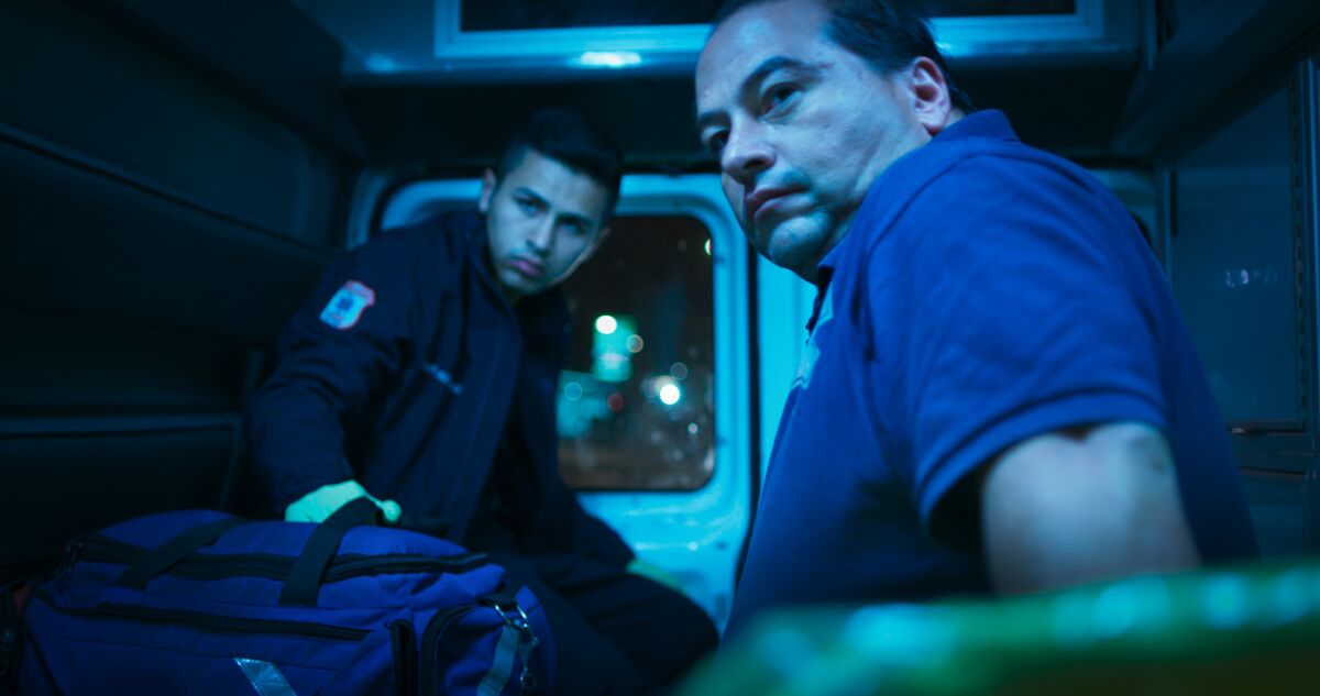 Juan Ochoa and Fernando Ochoa ride in the back of their family's ambulance in the documentary 'Midnight Family'