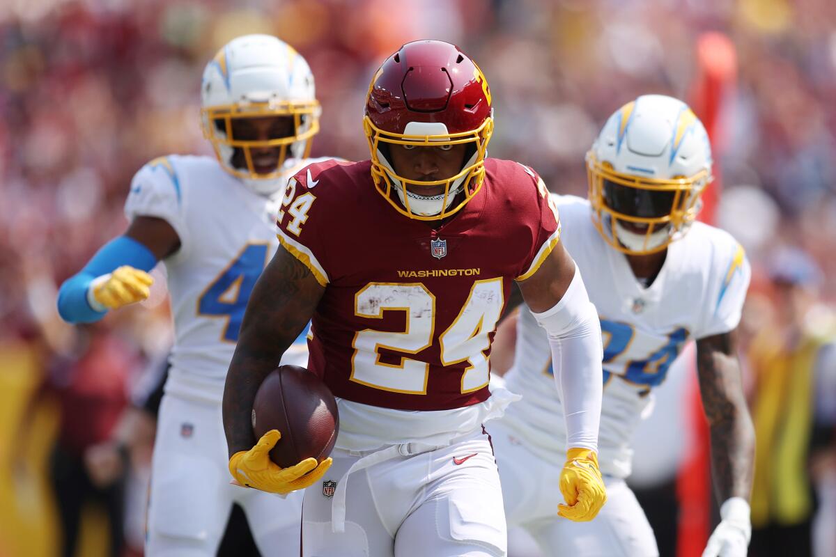 Washington Football Team running back Antonio Gibson (24) with My