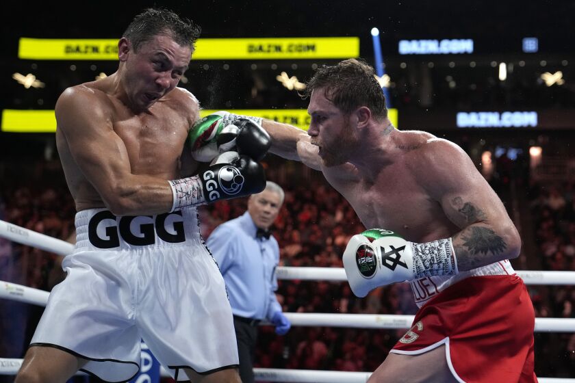 Canelo Alvarez, right, fights Gennady Golovkin in a super middleweight title boxing match, Saturday, Sept. 17, 2022, in Las Vegas. (AP Photo/John Locher)