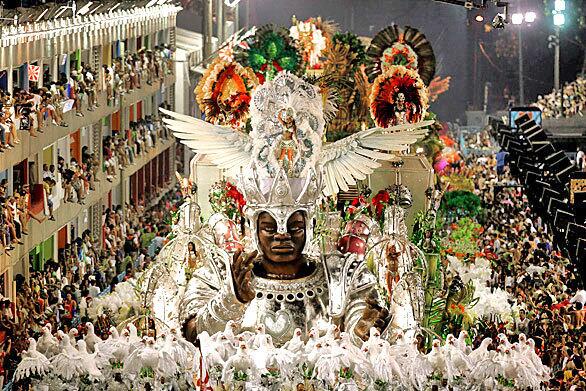 Vibrant colors, overwhelming crowds, ribald pageantry and many strategically placed feathers propel a Viradouro samba school float through the Sambodrome in Rio de Janeiro on Fat Tuesday.