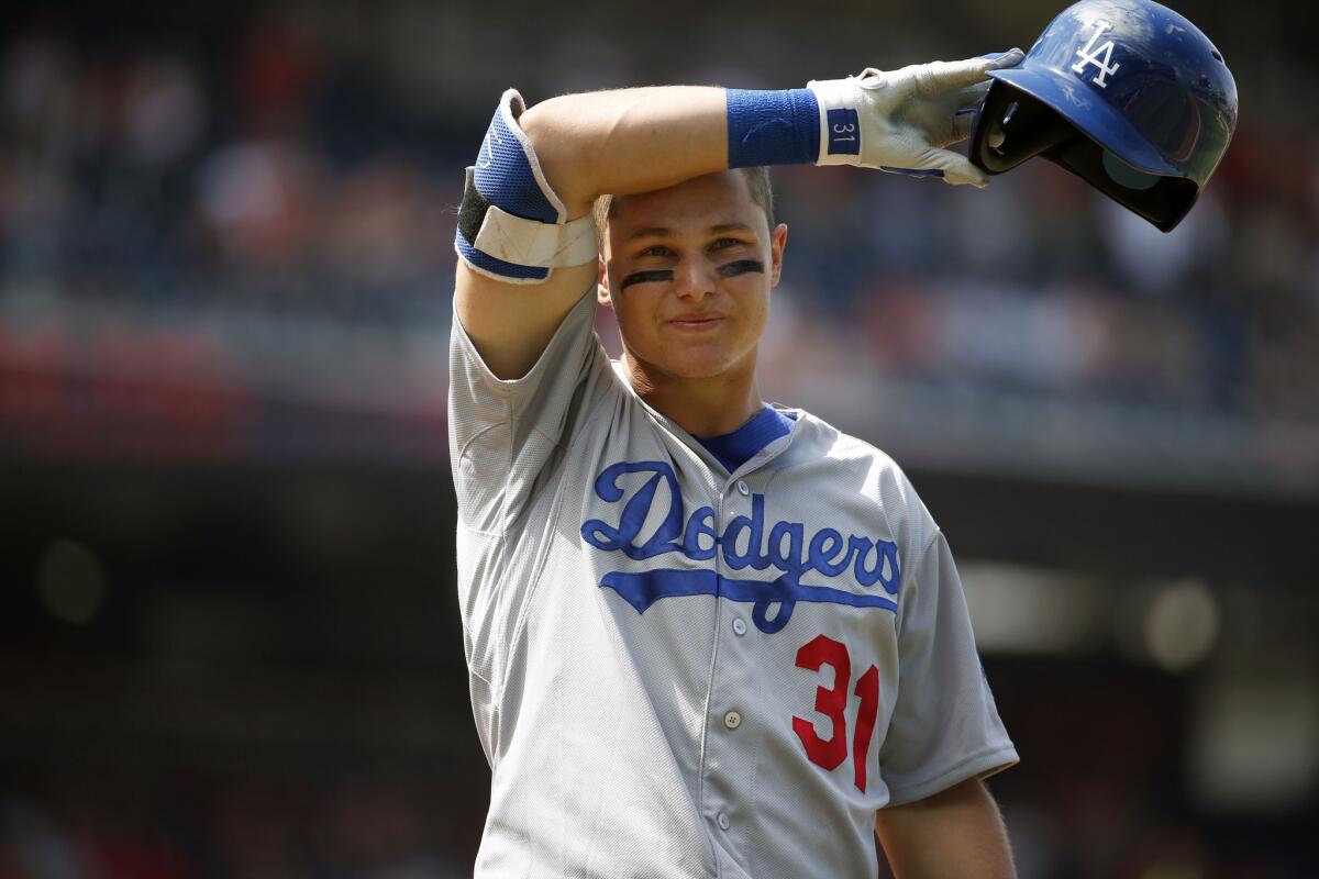 Joc Pederson wipes his brow during an at bat during the ninth inning of a resumed game against the Washington Nationals on July 18.