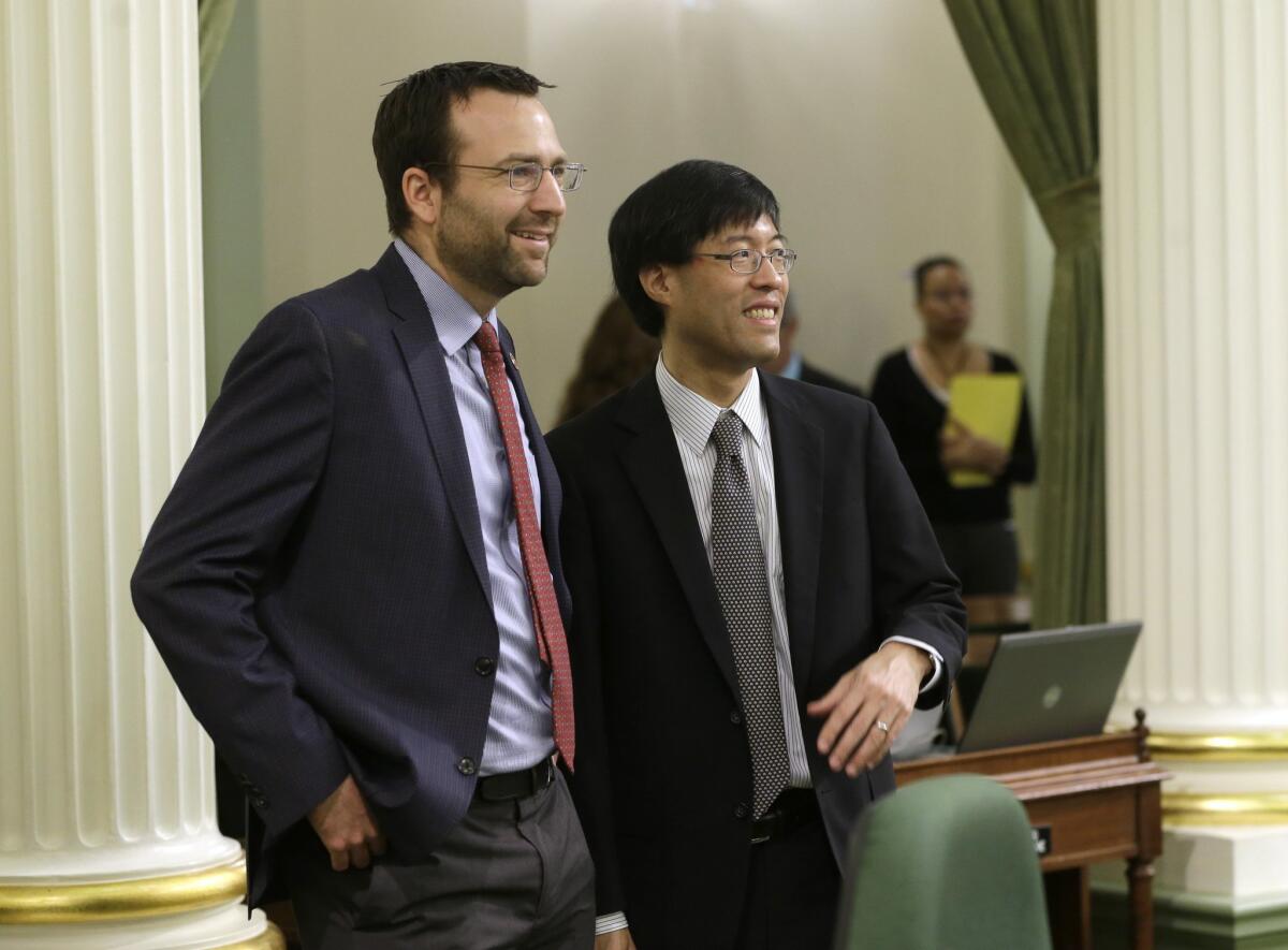 Sens. Ben Allen, (D-Santa Monica), left, and Richard Pan, (D-Sacramento), smile at the Capitol. They authored a hotly contested bill approved by the Assembly Thursday that would require more schoolchildren be vaccinated.