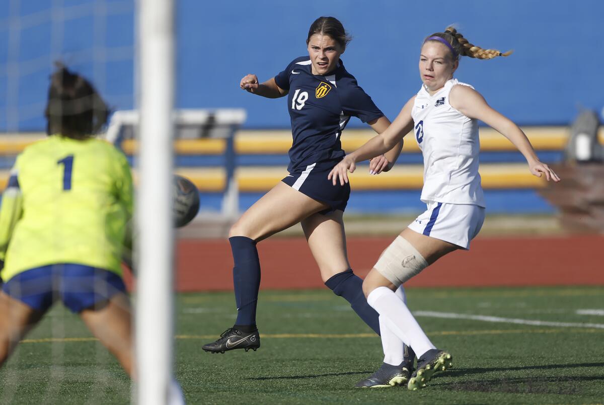 Marina's Kayden Smith (19) takes a shot on goal during a CIF Southern Section Division 3 playoff game against Webb.