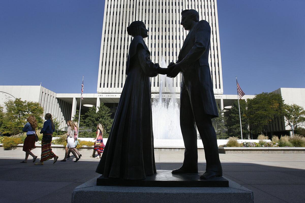 A statue of Joseph and Emma Smith in Salt Lake City. Mormon church founder Joseph Smith had an underage bride and was married to other men's wives during the early days of the faith when polygamy was practiced, a new church essay reveals.