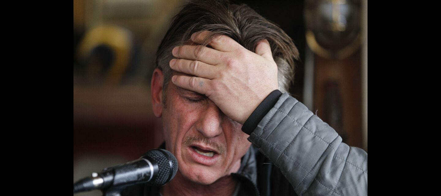 Actor Sean Penn pauses as he answers questions people had written down for him.