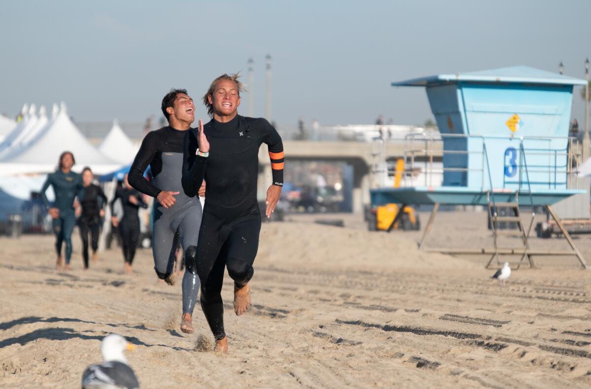 U18 division surfer Lucas Owston and team alternate Luke Guinaldo run drills.