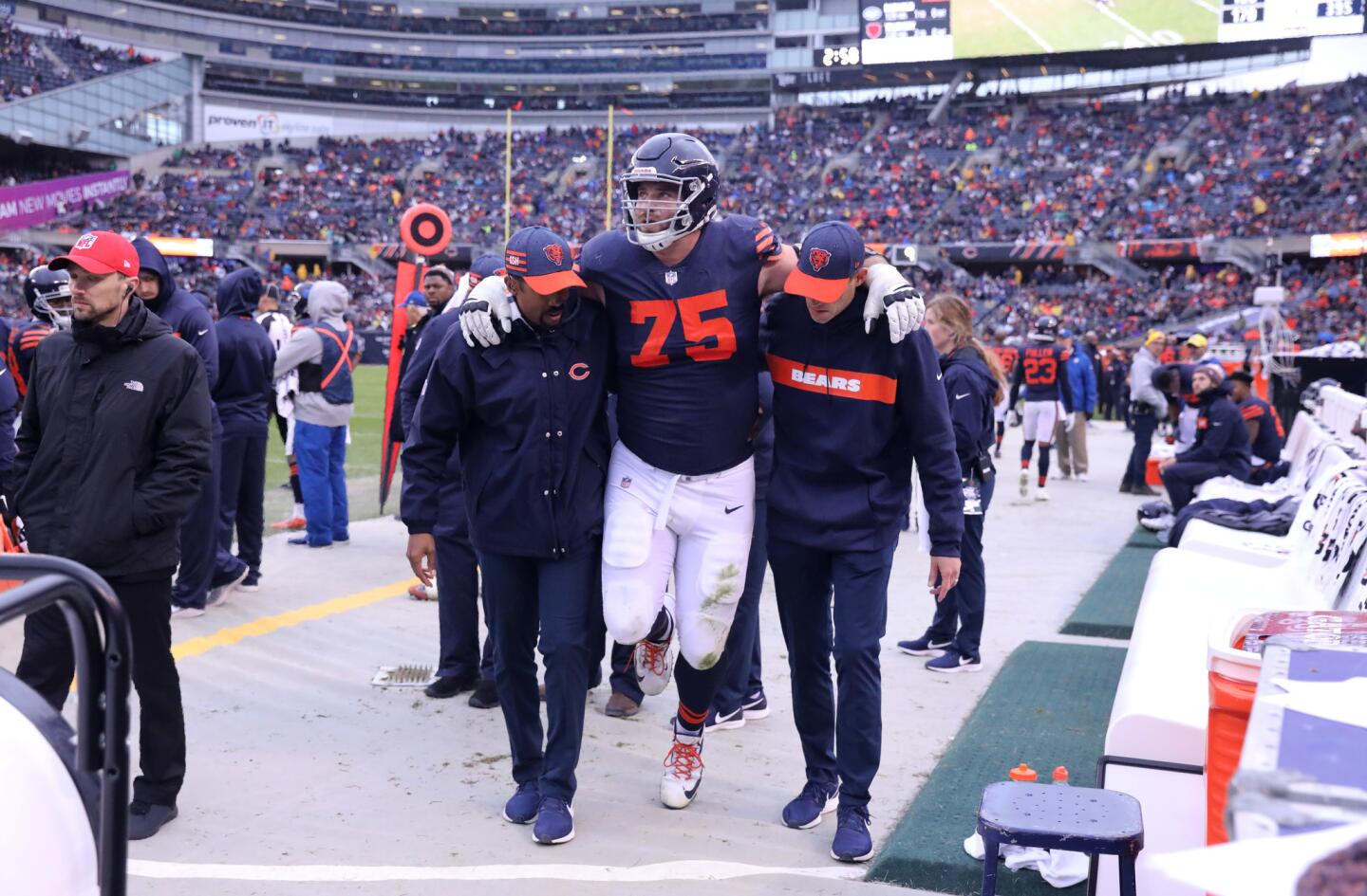 Bears offensive guard Kyle Long is helped off the field after suffering an injury in the fourth quarter of against the Jets at Soldier Field on Sunday, Oct. 28, 2018.