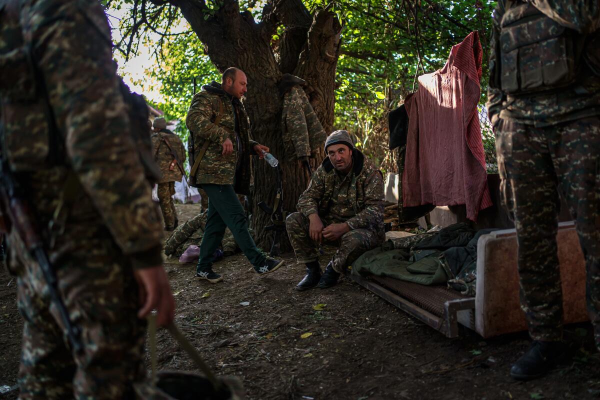 Soldiers shelter under trees to evade Azerbaijani drones near Hadrut, Nagorno-Karabakh.