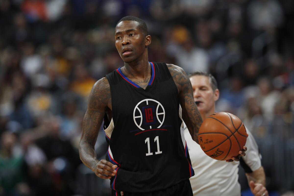 Clippers guard Jamal Crawford, shown playing against the Denver Nuggets on Saturday, regains his shooting touch, scoring 19 points against the Atlanta Hawks.