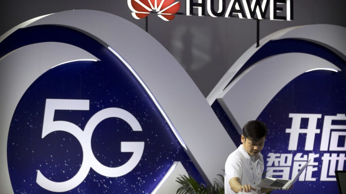 A display for 5G wireless technology from Chinese technology firm Huawei at the PT Expo in Beijing.