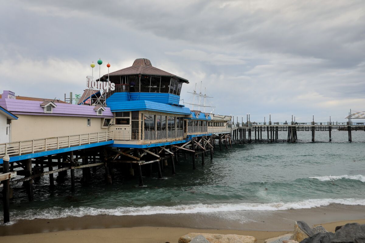 A restaurant on a pier at the beach