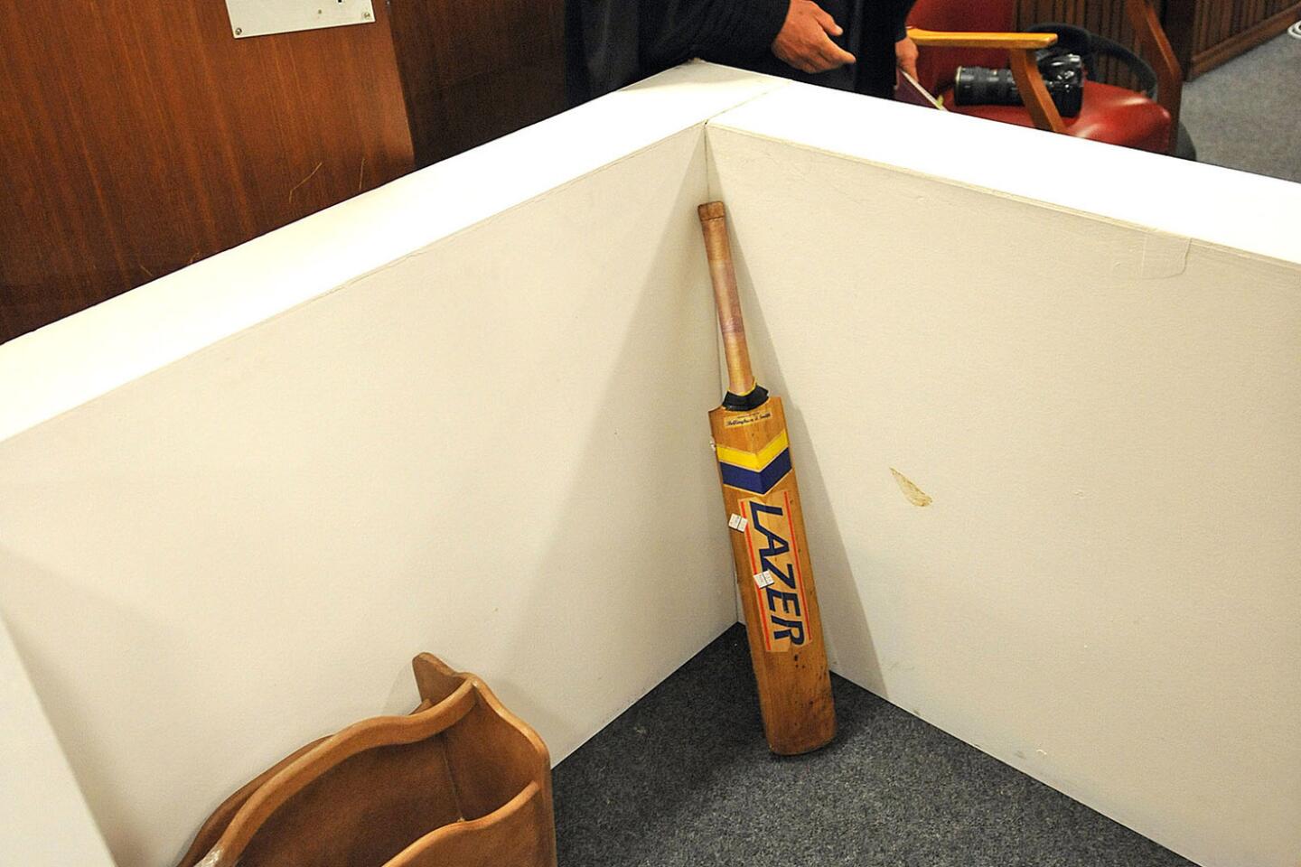 State prosecutor Gerrie Nel, alongside a reconstruction of a toilet cubicle, through which Oscar Pistorius shot and killed his girlfriend, Reeva Steenkamp on St. Valentine's day in 2013.