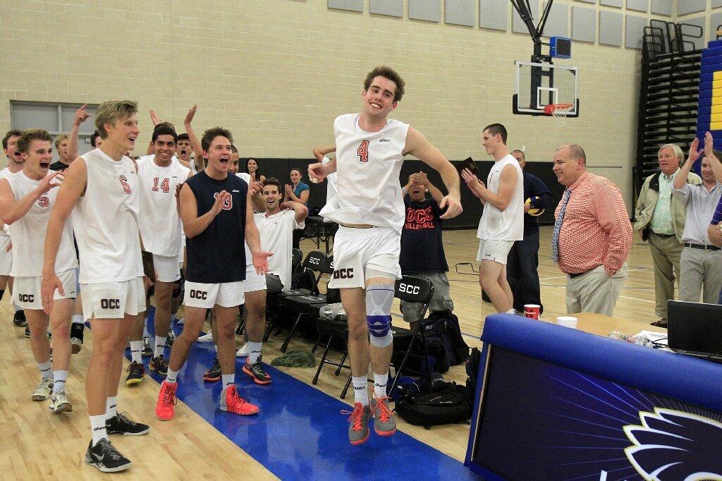 Orange Coast College's Brendan Duff (4) gets up to accept the Most Valuable Player award after the Pirates beat Santa Monica in the 2014 California Community College Athletic Assn. State Championship match.