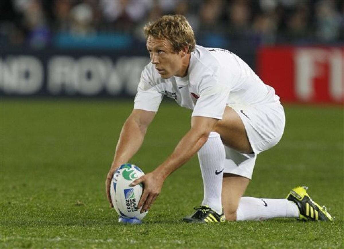 England's Jonny Wilkinson places the ball ahead of a penalty kick at goal during their Rugby World Cup game against Scotland at Eden Park stadium in Auckland, New Zealand, Saturday, Oct. 1, 2011. (AP Photo/Alastair Grant)