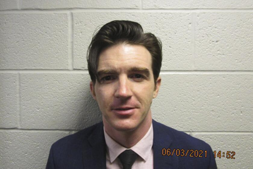 A booking photo of Jared Drake Bell 