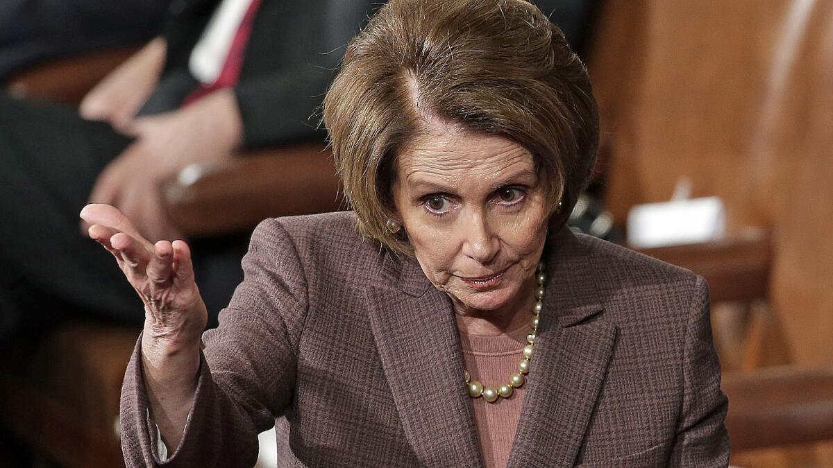 House Minority Leader Nancy Pelosi talks with colleagues before Israeli Prime Minister Benjamin Netanyahu addressed a joint meeting of the United States Congress.