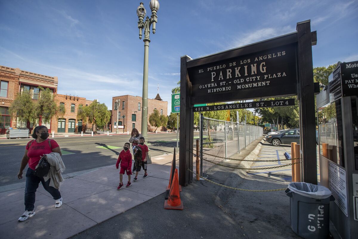 A sign marks a parking lot of El Pueblo de Los Angeles