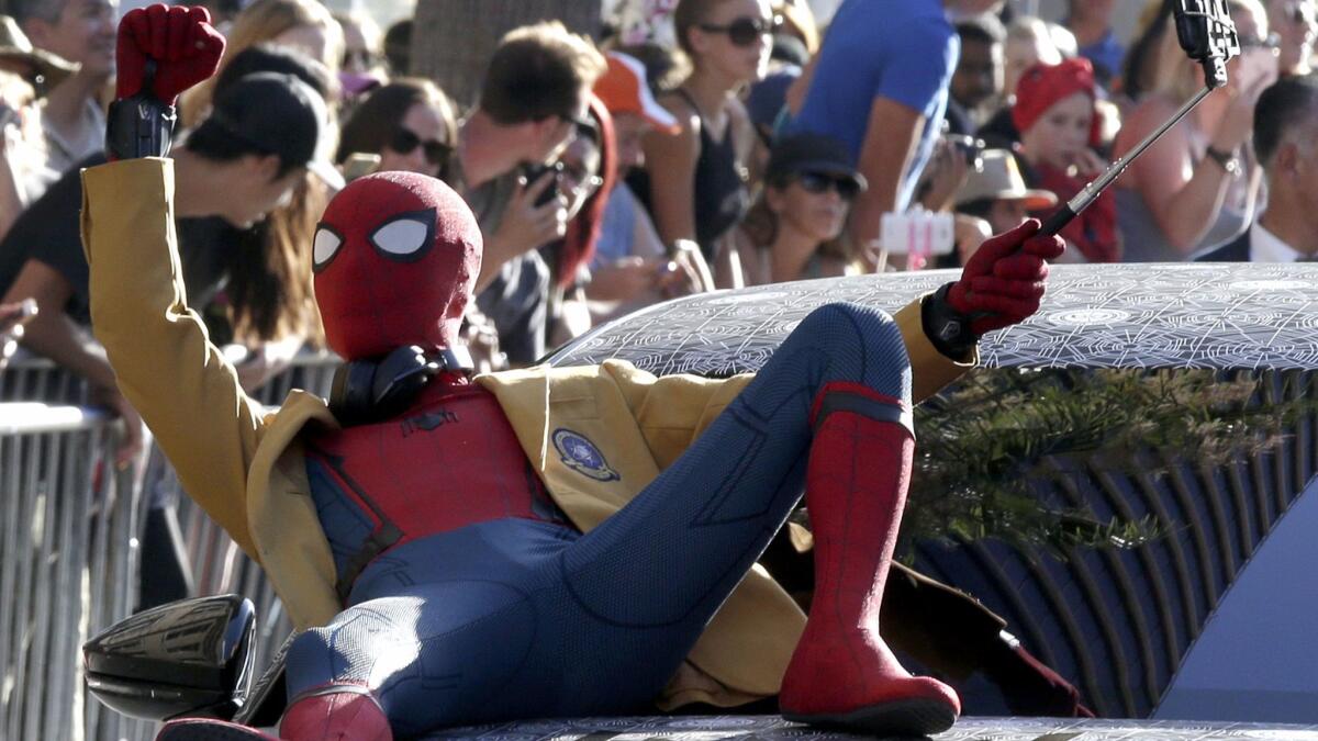 A Spider-Man impersonator arrives for the movie premiere of "Spider-Man: Homecoming" at the TCL Chinese Theatre in Hollywood last week. Sony and Disney teamed up for the latest take on the Marvel superhero with the spidey sense.