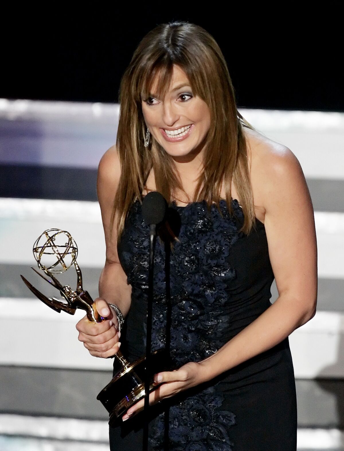 Mariska Hargitay accepts the award for lead actress in a drama series for her work on "Law & Order: Special Victims Unit" at the 58th Primetime Emmy Awards in 2006.