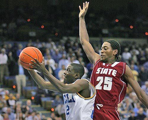 COMING THROUGH: UCLAs Darren Collison scores a layup ahead of Kyle Weaver in the final minute for the Bruins last basket.