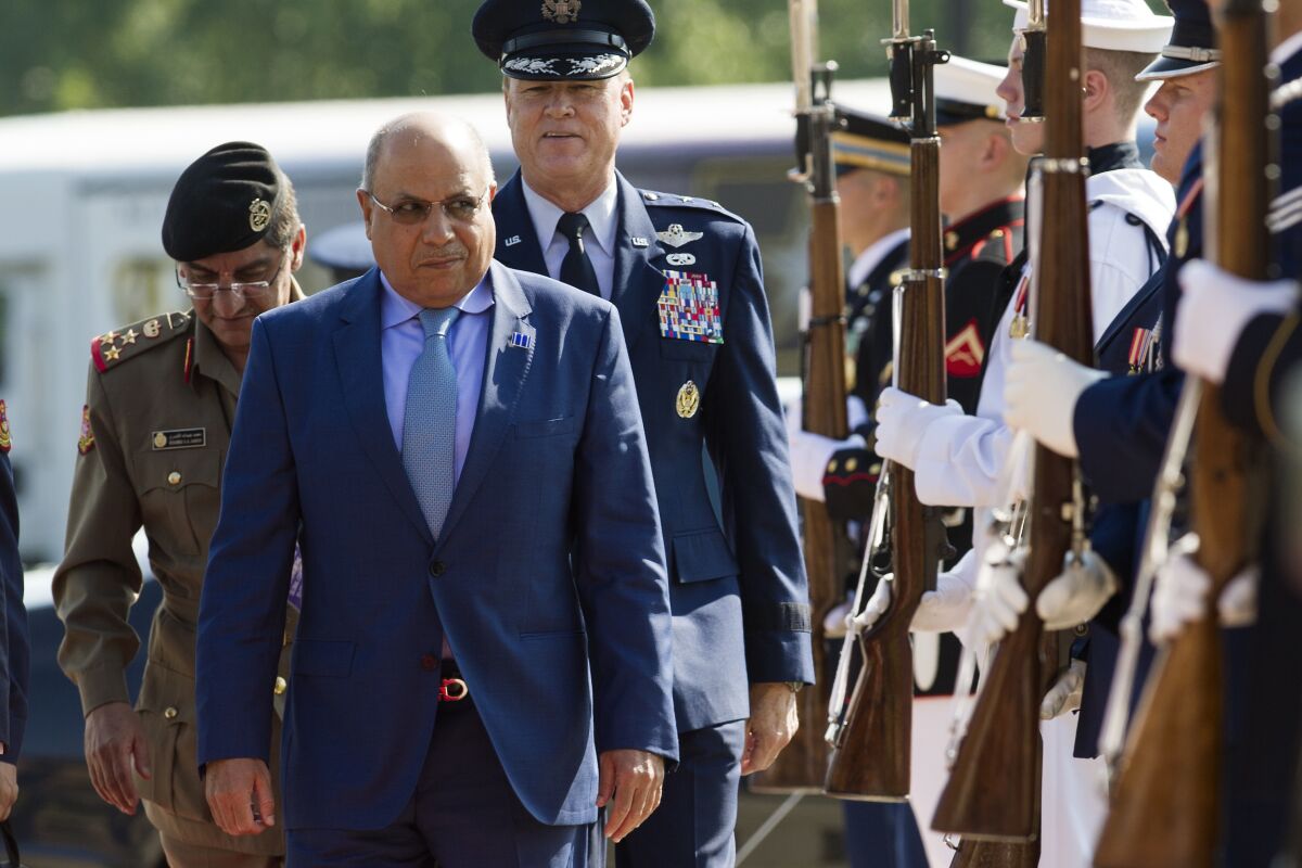 FILE - In this July 20, 2016 file photo, Kuwaiti Minister of Defense Sheikh Khalid al-Jarrah Al-Sabah arrives to attend the Global Coalition to Counter ISIL Meeting, hosted by Defense Secretary Ash Carter, at Andrews Air Force Base, Md. A Kuwaiti court on Tuesday, March 8, 2022, acquitted two former ministers and their co-defendants of the corruption charges they faced in an explosive case that tarnished the government and was widely seen as a test of accountability. The charges against Kuwait's former Prime Minister Sheikh Jaber al-Mubarak Al Sabah and his ally, former Interior Minister Sheikh Khalid al-Jarrah Al Sabah, along with other officials, concerned the embezzlement of $790 million that had gone missing from a military aid fund years ago. (AP Photo/Cliff Owen)