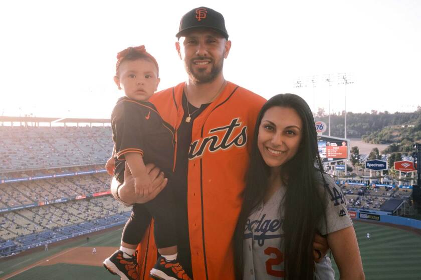 Maryanna Solis with her husband Michael and daughter Millie at Dodger Stadium.