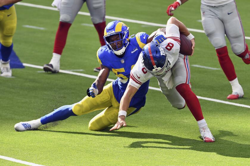 Rams outside linebacker Leonard Floyd brings down Giants quarterback Daniel Jones on Oct. 4, 2020.