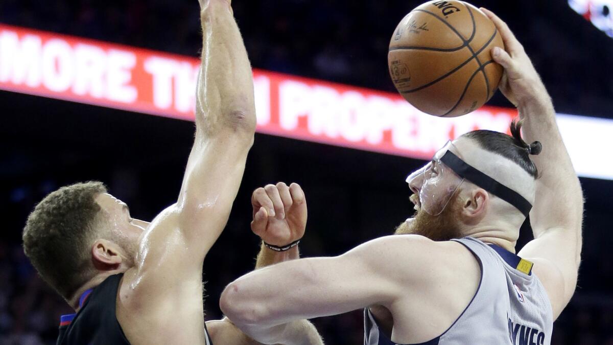 Pistons center Aron Baynes tries to score inside against Clippers forward Blake Griffin during the first half Friday night.